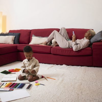 full-shot-mother-laying-couch